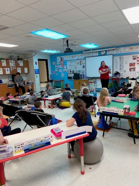 Teacher in front of classroom